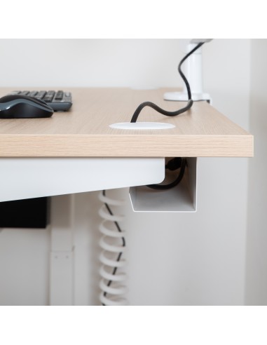 Organisateur range-câbles métallique noir fixé sous un bureau