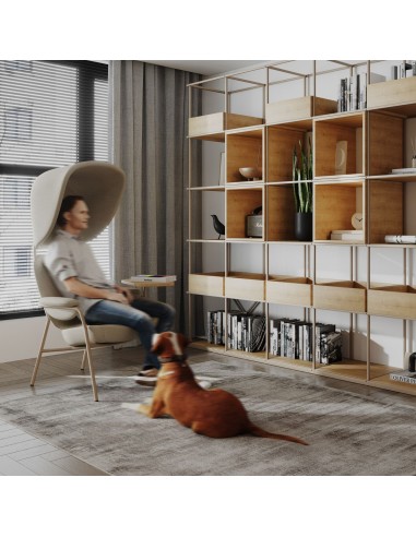 Fauteuil Epocc Lounge en tissu beige dans un salon moderne avec mur vert – Epocc Lounge