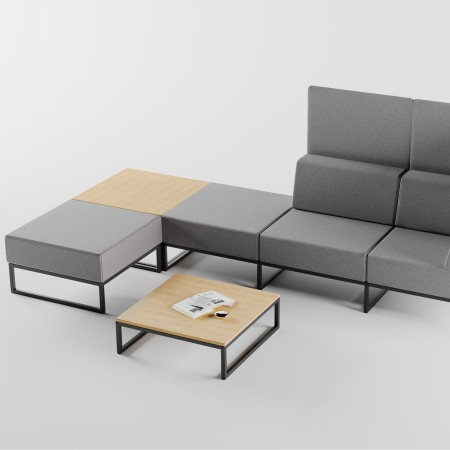 Composition moderne de canapés Plint autour d’une table basse assortie, illustrant la modularité du mobilier. - Plint