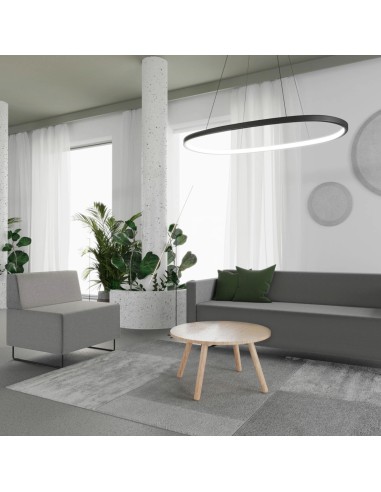 Coin détente lumineux avec assises modulaires claires et table ronde. - Quadra