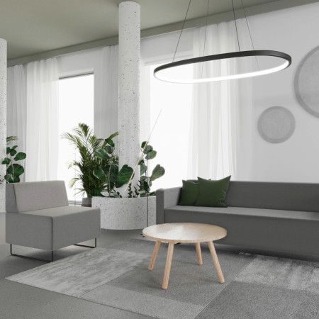 Coin détente lumineux avec assises modulaires claires et table ronde. - Quadra