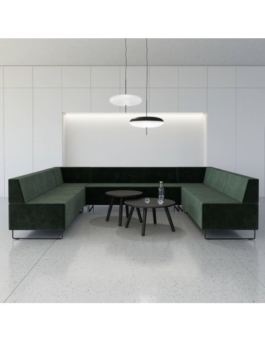 Espace collaboratif moderne avec banquettes vertes formant un cercle convivial. - Quadra