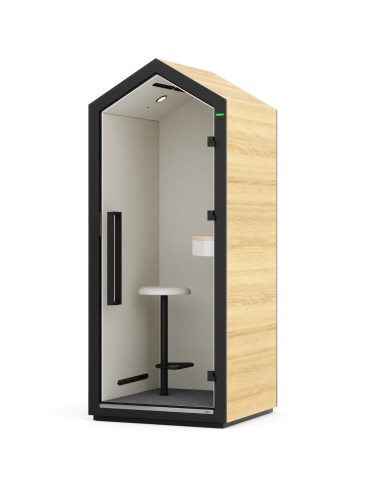 Vue extérieure de la cabine Treehouse avec finition bois clair et cadre noir. - Treehouse