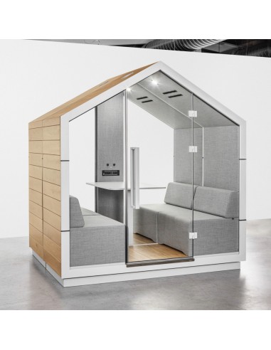 Cabine Treehouse placée dans un environnement de coworking avec mobilier bois et métal. - Treehouse