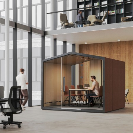 Cabine Treehouse finition bois clair et cadre noir, ouverte sur un espace de travail moderne. - Treehouse 2