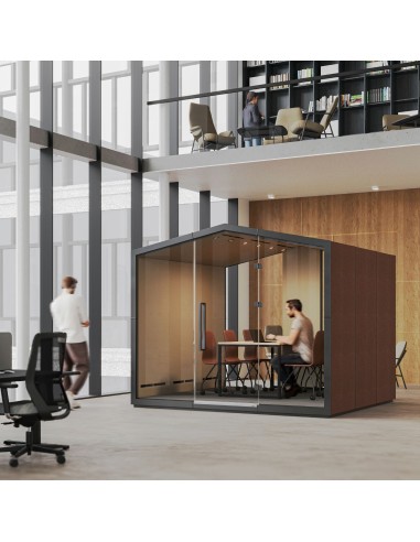 Cabine acoustique Treehouse installée dans un grand atrium lumineux avec mobilier de coworking. - Treehouse